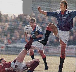 Charlie Adam tackles Hateley